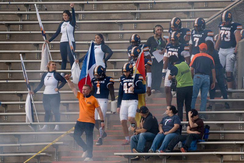 UTEP head coach Scotty Walden and his team walk down to the field for a Conference USA game against Liberty at the Sun Bowl in El Paso, Texas, on Wednesday, Oct. 8, 2025.