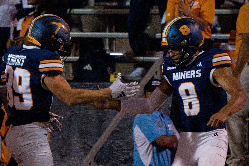 UTEP’s Josh Schuchts (89) and Shay Smith (8) celebrate a two-point conversion during a Conference USA game at the Sun Bowl in El Paso, Texas, on Wednesday, Oct. 8, 2025.