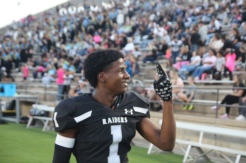 Randall's Braylon Thompson signals to the Raiders' crowd during a District 2-4A Division I game against Dumas at Happy State Bank Stadium on Oct. 9, 2025.