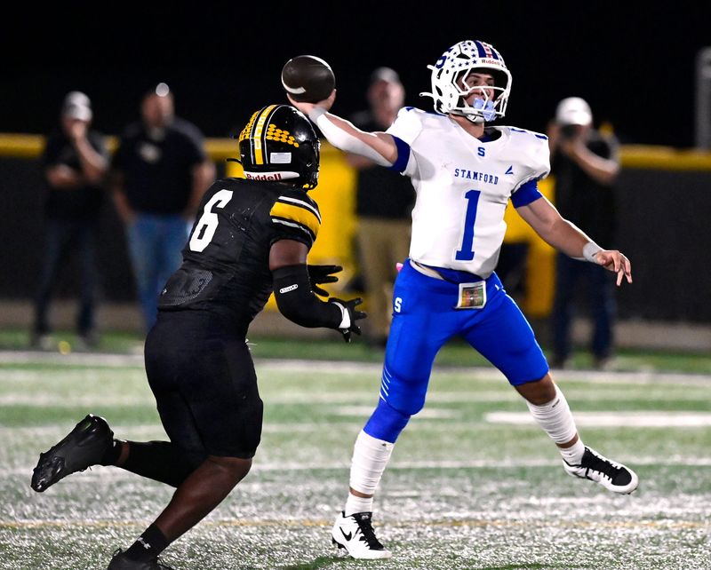 Cisco linebacker Noaa Hernandez closes in on Stamford quarterback Mason Mueller as he passes the ball downfield during Friday’s game in Cisco Oct. 10, 2025. Final score was 30-20, Cisco.