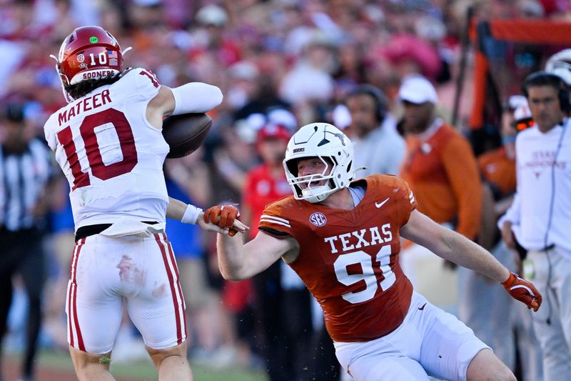 Oct 11, 2025; Dallas, Texas, USA; Texas Longhorns defensive end Ethan Burke (91) tackles Oklahoma Sooners quarterback John Mateer (10) during the second half at the Cotton Bowl. Mandatory Credit: Jerome Miron-Imagn Images