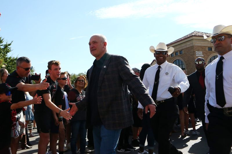 Oct 11, 2025; Lubbock, Texas, USA; Texas Tech Red Raiders head coach Joey McGuire greets fans before the game against the Kansas Jayhawks at Jones AT&T Stadium. Mandatory Credit: Michael C. Johnson-Imagn Images
