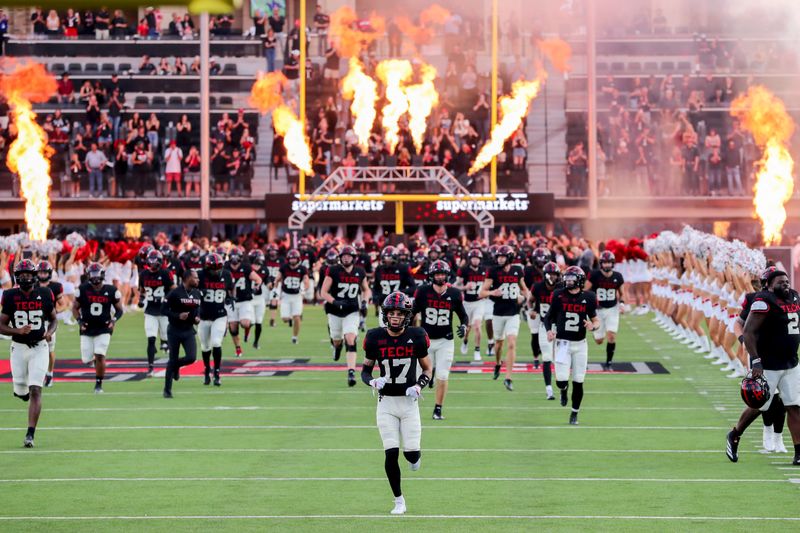 Oct 11, 2025; Lubbock, Texas, USA; The Texas Tech Red Raiders enter the field before the game against the Kansas Jayhawks at Jones AT&T Stadium. Mandatory Credit: Michael C. Johnson-Imagn Images