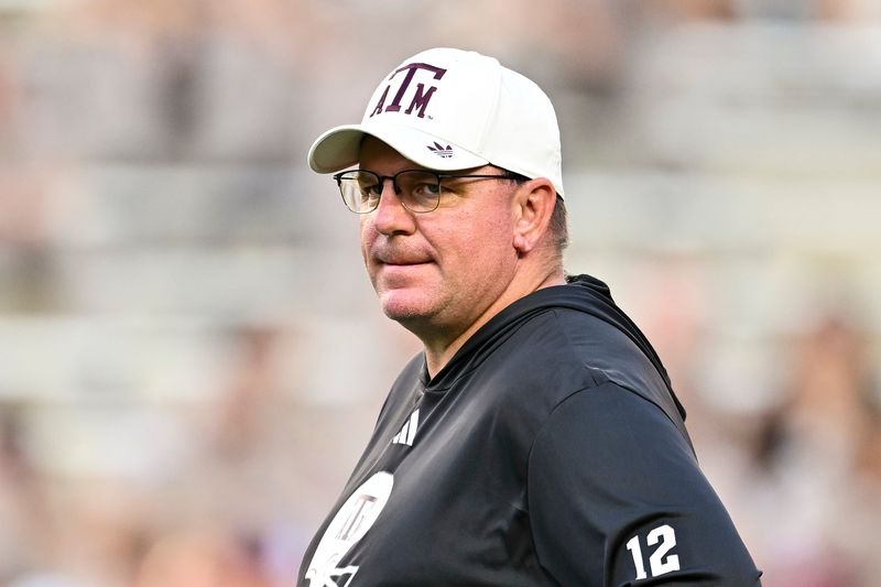 Oct 11, 2025; College Station, Texas, USA; Texas A&M Aggies head coach Mike Elko looks on prior to the game against the Florida Gators at Kyle Field. Mandatory Credit: Maria Lysaker-Imagn Images