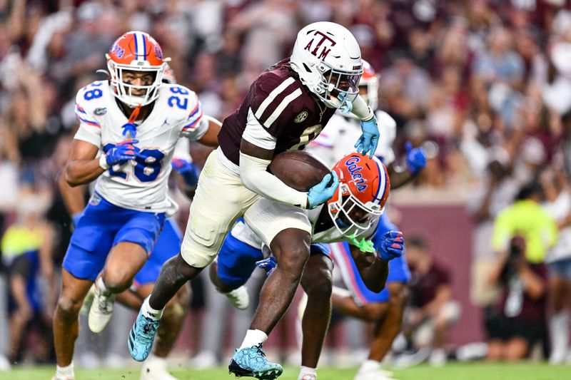 Oct 11, 2025; College Station, Texas, USA; Texas A&M Aggies running back Le'Veon Moss (8) runs the ball in for a touchdown during the second quarter against the Florida Gators at Kyle Field. Mandatory Credit: Maria Lysaker-Imagn Images