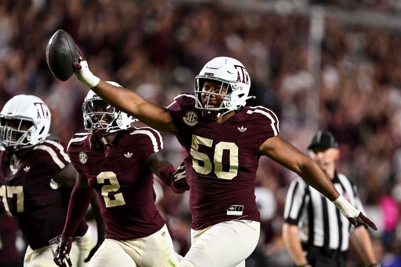 Oct 11, 2025; College Station, Texas, USA; Texas A&M Aggies defensive end Dayon Hayes (50) reacts after recovering a fumble in the fourth quarter against the Florida Gators at Kyle Field. Mandatory Credit: Maria Lysaker-Imagn Images