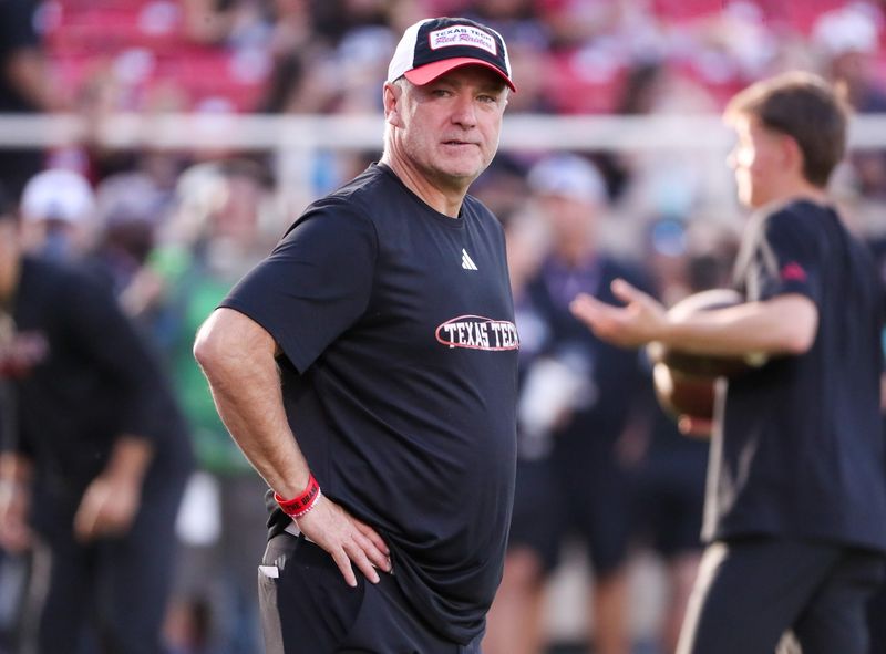 Texas Tech head coach Joey McGuire looks on during warmups prior to a Big 12 Conference football game, Saturday, Oct. 11, 2025, at Jones AT&T Stadium in Lubbock.