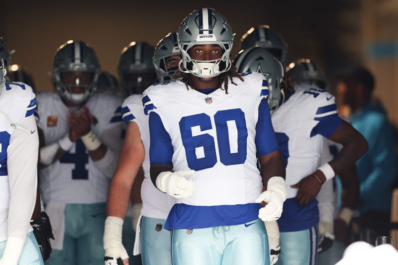 Oct 12, 2025; Charlotte, North Carolina, USA; Dallas Cowboys offensive tackle Tyler Guyton (60) prepares to enter the field prior to the game against the Carolina Panthers at Bank of America Stadium. Mandatory Credit: Cory Knowlton-Imagn Images