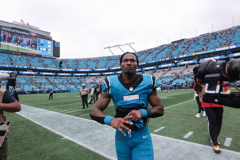 Oct 12, 2025; Charlotte, North Carolina, USA; Carolina Panthers running back Rico Dowdle (5) looks on after the game against the Dallas Cowboys at Bank of America Stadium. Mandatory Credit: Scott Kinser-Imagn Images