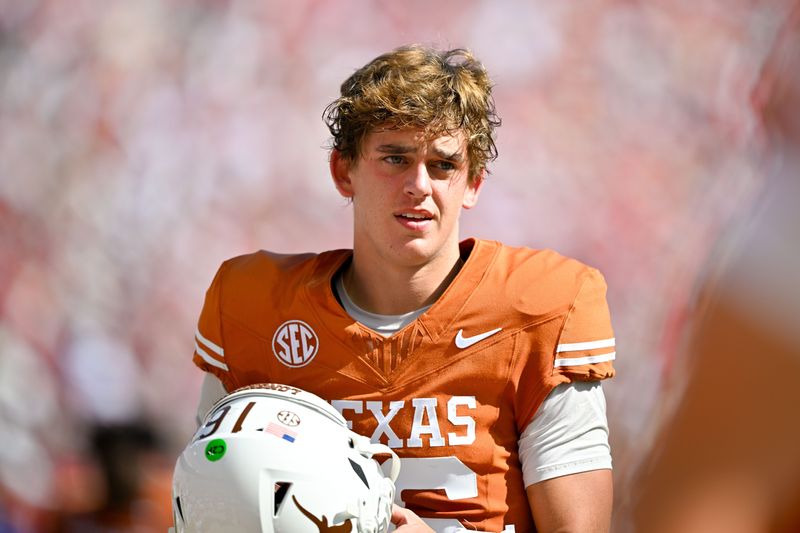 Oct 11, 2025; Dallas, Texas, USA; Texas Longhorns quarterback Arch Manning (16) looks on before the game against the Oklahoma Sooners at the Cotton Bowl. Mandatory Credit: Jerome Miron-Imagn Images