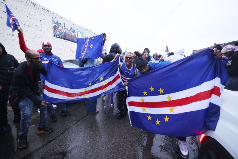 Fans gathered behind the Money Market Inc., 245 Main St., Brockton, to celebrate Cape Verde's 3-0 win against Eswatini on Monday, Oct. 13, 2025. Cape Verde's victory qualified them for the 2026 FIFA Men's World Cup. The tournament will be held in Canada, Mexico and the Unites States from June to July 2026.