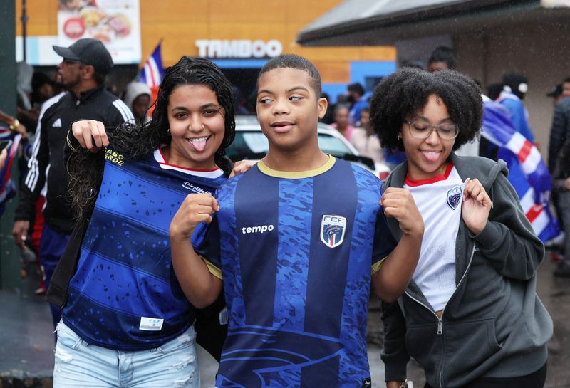 Fans gathered behind the Money Market Inc., 245 Main St., Brockton, to celebrate Cape Verde's 3-0 win against Eswatini on Monday, Oct. 13, 2025. Cape Verde's victory qualified them for the 2026 FIFA Men's World Cup. The tournament will be held in Canada, Mexico and the Unites States from June to July 2026.