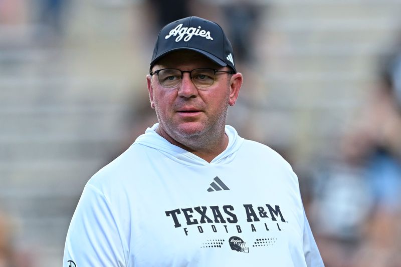 Oct 4, 2025; College Station, Texas, USA; Texas A&M Aggies head coach Mike Elko looks on prior to the game against the Mississippi State Bulldogs at Kyle Field. Mandatory Credit: Maria Lysaker-Imagn Images