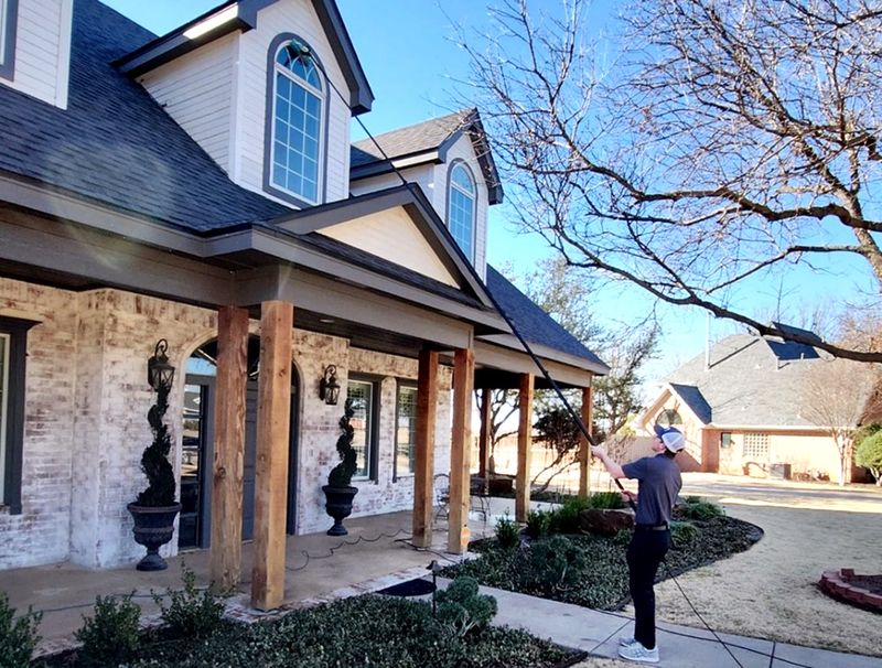 Hudson Pietsek cleans the exterior of a Big Country home March 2. The Abilene High senior will be awarded for his entrepreneurial spirit this month at the Annual Future Texas Business Legend Awards Luncheon in Housto