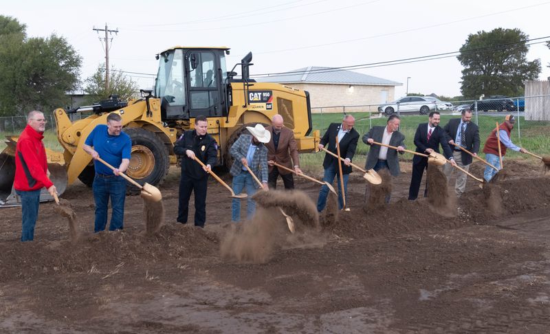 Amarillo city officials and firefighters turn the first shovels of dirt during the Oct. 14, 2025, groundbreaking ceremony for Fire Station 14. The two-story station will improve emergency response times in the growing northwest area.