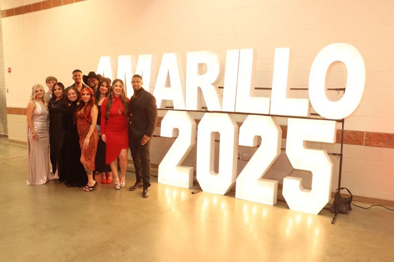 Guests pose in front of an illuminated “Amarillo 2025” sign during the 2025 Best of Amarillo Community’s Choice Awards on Thursday, Oct. 16, at the Amarillo Civic Center’s Heritage Room.