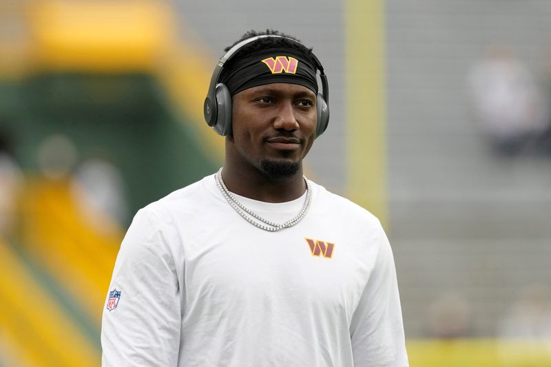 Sep 11, 2025; Green Bay, Wisconsin, USA; Washington Commanders wide receiver Deebo Samuel (1) looks on before the game against the Green Bay Packers at Lambeau Field. Mandatory Credit: Jeff Hanisch-Imagn Images