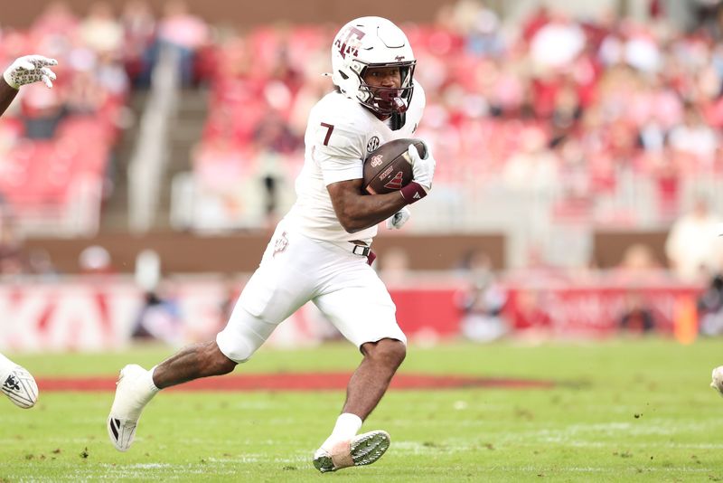 Oct 18, 2025; Fayetteville, Arkansas, USA; Texas A&M Aggies wide receiver KC Concepcion (7) runs after a catch during the first quarter against the Arkansas Razorbacks at Donald W. Reynolds Razorback Stadium. Mandatory Credit: Nelson Chenault-Imagn Images