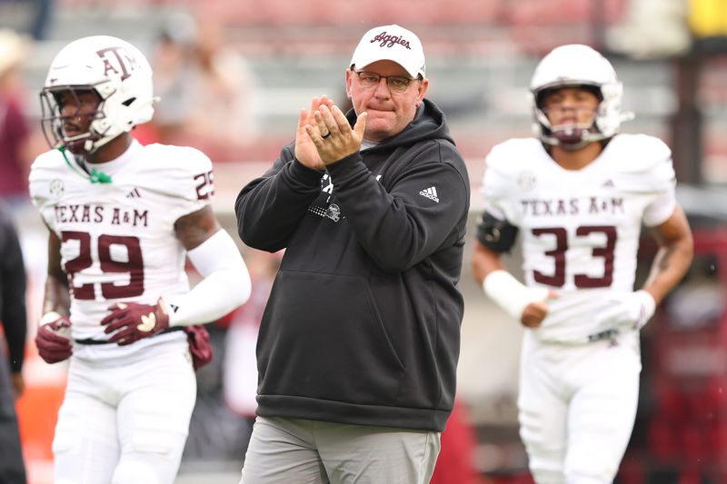 Oct 18, 2025; Fayetteville, Arkansas, USA; Texas A&M Aggies head coach Mike Elko prior to the game against the Arkansas Razorbacks at Donald W. Reynolds Razorback Stadium. Mandatory Credit: Nelson Chenault-Imagn Images