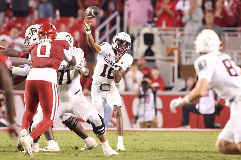 Oct 18, 2025; Fayetteville, Arkansas, USA; Texas A&M Aggies quarterback Marcel Reed (10) passes in the fourth quarter against the Arkansas Razorbacks at Donald W. Reynolds Razorback Stadium. Mandatory Credit: Nelson Chenault-Imagn Images