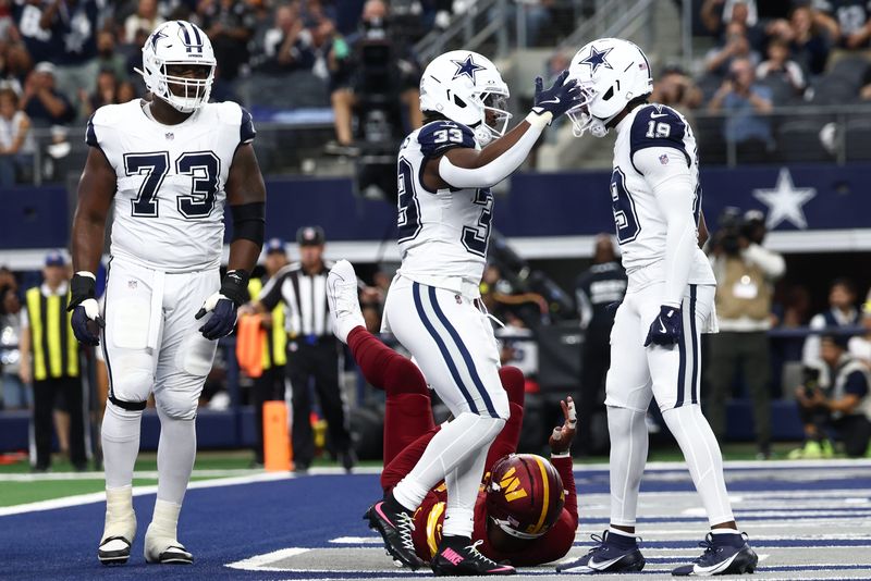 Oct 19, 2025; Arlington, Texas, USA; Dallas Cowboys running back Javonte Williams (33) celebrates after scoring a touchdown against the Washington Commanders with wide receiver Ryan Flournoy (19) during the first quarter of the game at AT&T Stadium. Mandatory Credit: Kevin Jairaj-Imagn Images