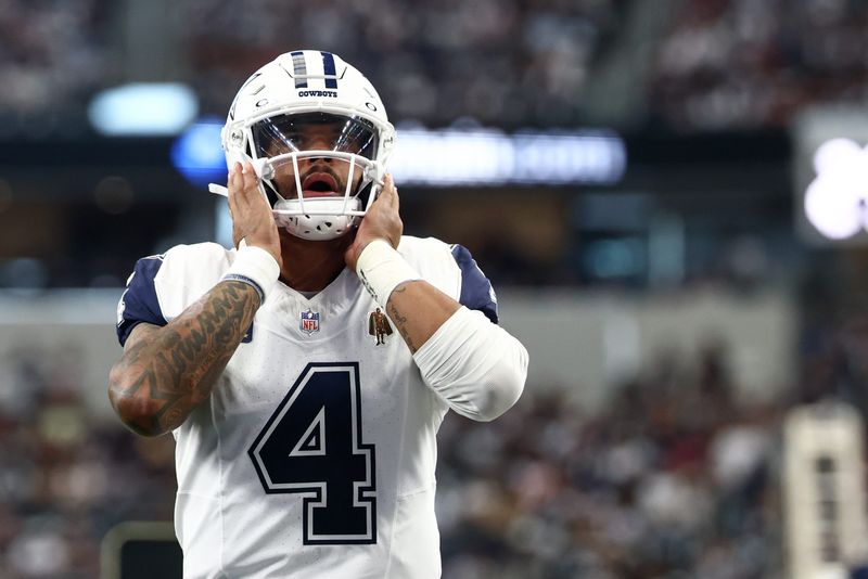 Oct 19, 2025; Arlington, Texas, USA; Dallas Cowboys quarterback Dak Prescott (4) looks on prior to the game against the Washington Commanders at AT&T Stadium. Mandatory Credit: Kevin Jairaj-Imagn Images
