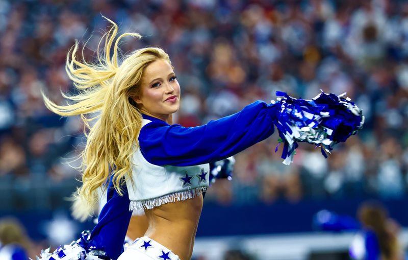 Oct 19, 2025; Arlington, Texas, USA; Dallas Cowboys cheerleader performs during the game against the Washington Commanders at AT&T Stadium. Mandatory Credit: Kevin Jairaj-Imagn Images