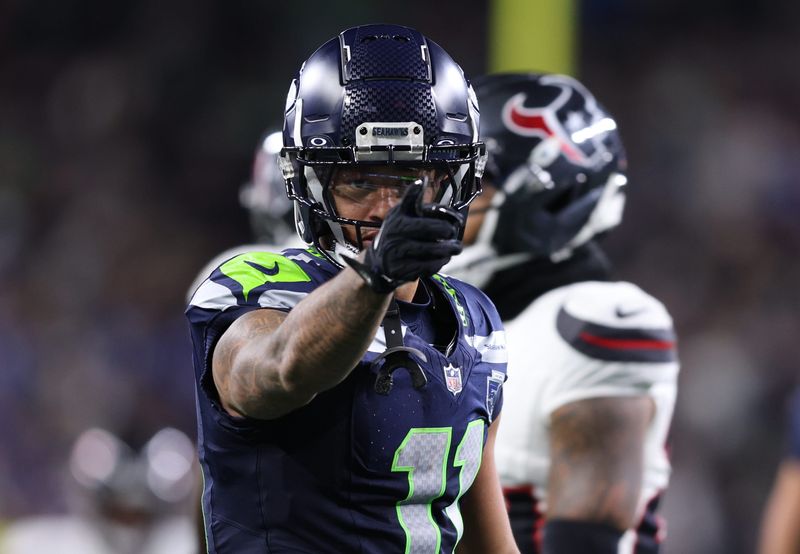 Oct 20, 2025; Seattle, Washington, USA; Seattle Seahawks wide receiver Jaxon Smith-Njigba (11) celebrates after a first down during the third quarter against the Houston Texans at Lumen Field. Mandatory Credit: Kevin Ng-Imagn Images