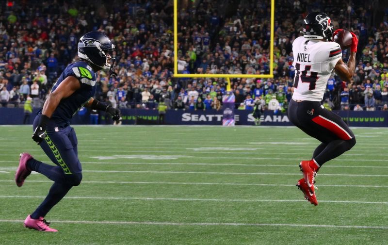 Oct 20, 2025; Seattle, Washington, USA; Houston Texans wide receiver Jaylin Noel (14) catches a pass during the fourth quarter against the Seattle Seahawks at Lumen Field. Mandatory Credit: Steven Bisig-Imagn Images