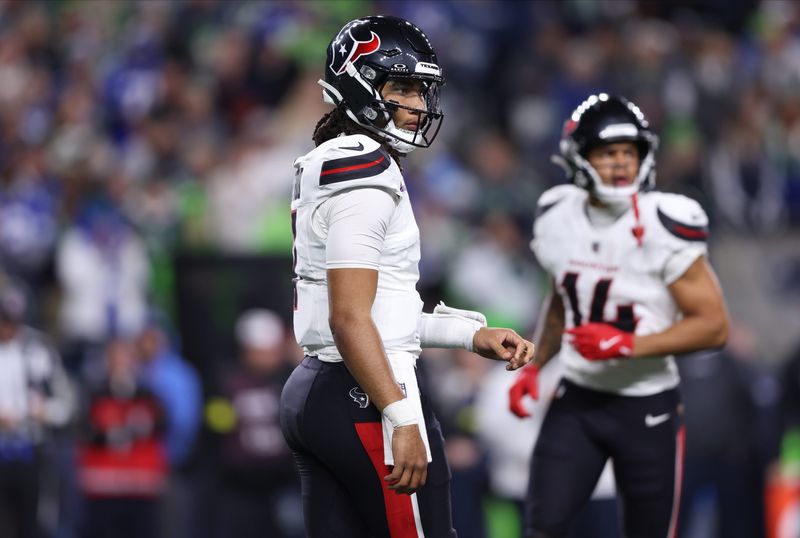 Oct 20, 2025; Seattle, Washington, USA; Houston Texans quarterback C.J. Stroud (7) looks to the sideline during the fourth quarter against the Seattle Seahawks at Lumen Field. Mandatory Credit: Kevin Ng-Imagn Images