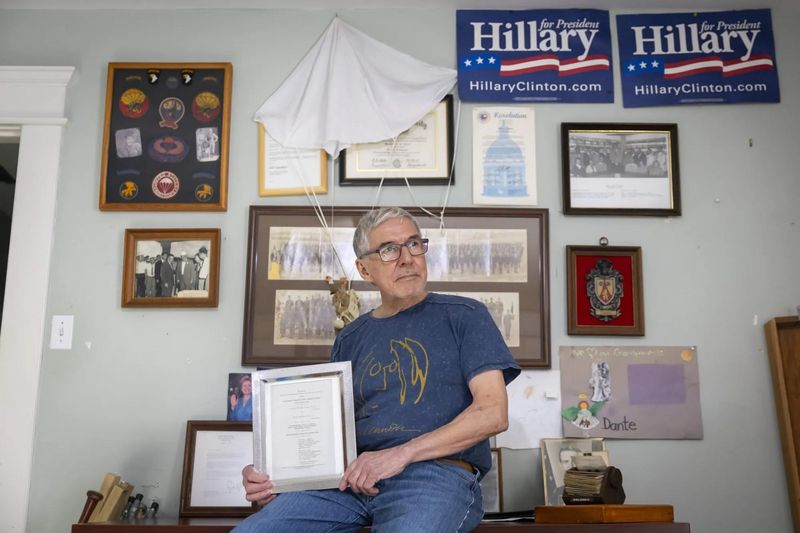 Marc Campos holds a copy of the lawsuit won by his father, Tony Campos, in his Heights home on Oct. 21 in Houston. In 1987, Tony Campos sued the city of Baytown in a landmark case that opened the door for Black and Hispanic voters to join together to bring voting rights challenges across the country.