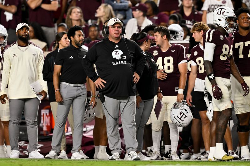 Oct 11, 2025; College Station, Texas, USA; Texas A&M Aggies head coach Mike Elko looks on during the third quarter against the Florida Gators at Kyle Field. Mandatory Credit: Maria Lysaker-Imagn Images