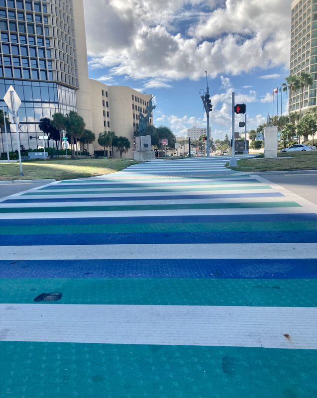 A blue-and-green crosswalk pays tribute to Texas A&M University-Corpus Christi at the Twigg Street and North Shoreline Boulevard intersection. It is among several crosswalks to be removed because of a state order.