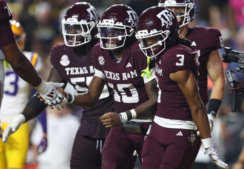 Oct 25, 2025; Baton Rouge, Louisiana, USA; Texas A&M Aggies quarterback Marcel Reed (10) celebrates with wide receiver Ashton Bethel-Roman (3) after a play during the second half against the Louisiana State Tigers at Tiger Stadium.