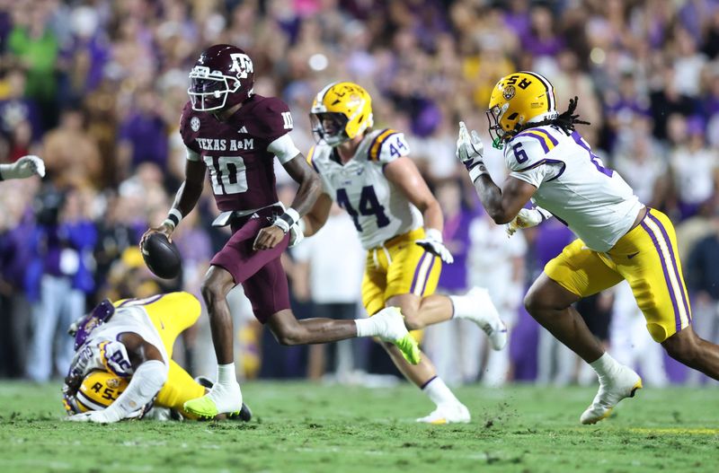 Oct 25, 2025; Baton Rouge, Louisiana, USA; Texas A&M Aggies quarterback Marcel Reed (10) runs for a touchdown during the first half against the Louisiana State Tigers at Tiger Stadium. Mandatory Credit: Stephen Lew-Imagn Images