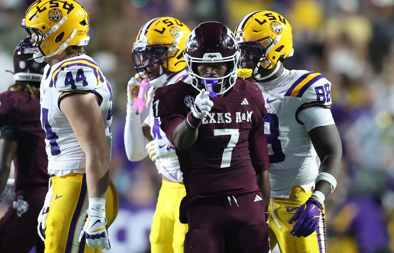 Oct 25, 2025; Baton Rouge, Louisiana, USA; Texas A&M Aggies wide receiver KC Concepcion (7) celebrates after a first down during the first half against the Louisiana State Tigers at Tiger Stadium. Mandatory Credit: Stephen Lew-Imagn Images