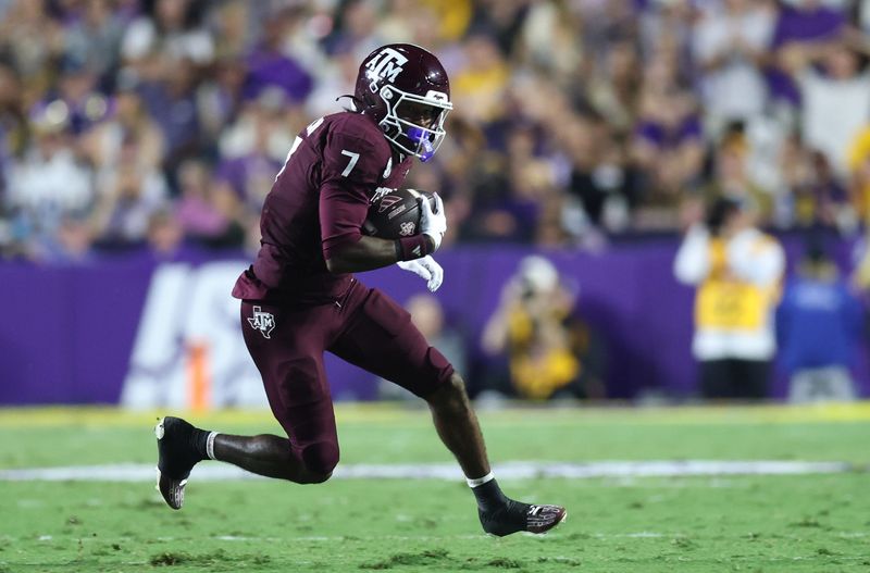 Oct 25, 2025; Baton Rouge, Louisiana, USA; Texas A&M Aggies wide receiver KC Concepcion (7) runs during the first half against the Louisiana State Tigers at Tiger Stadium. Mandatory Credit: Stephen Lew-Imagn Images