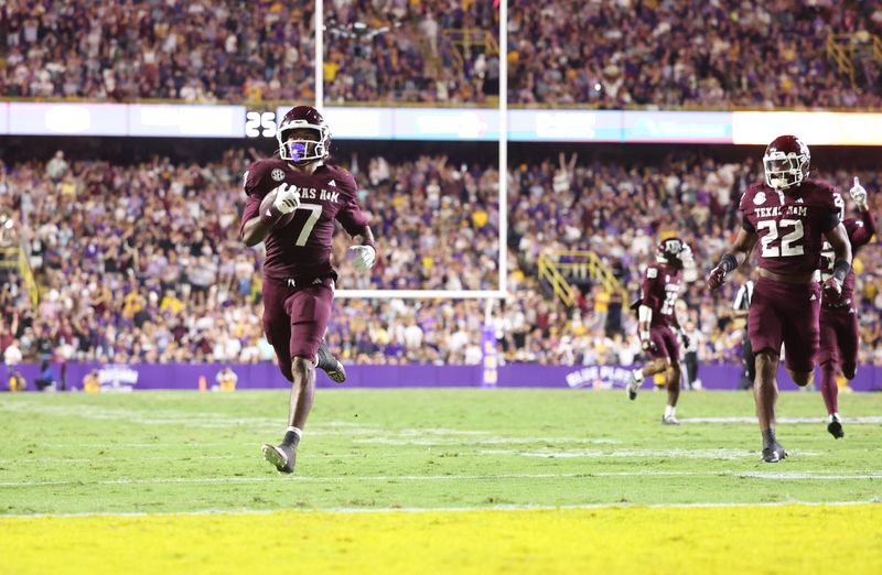 Oct 25, 2025; Baton Rouge, Louisiana, USA; Texas A&M Aggies wide receiver KC Concepcion (7) returns a punt for a touchdown during the second half against the Louisiana State Tigers at Tiger Stadium. Mandatory Credit: Stephen Lew-Imagn Images