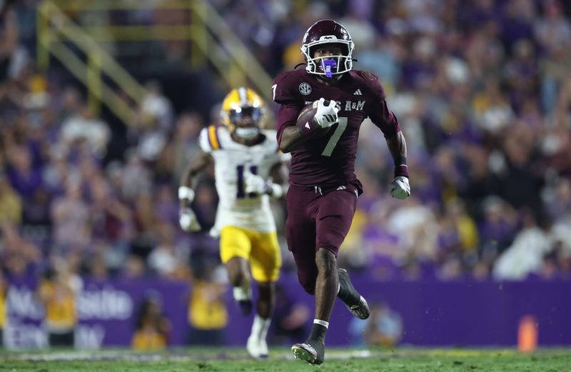 Oct 25, 2025; Baton Rouge, Louisiana, USA; Texas A&M Aggies wide receiver KC Concepcion (7) returns a punt for a touchdown during the second half against the Louisiana State Tigers at Tiger Stadium. Mandatory Credit: Stephen Lew-Imagn Images