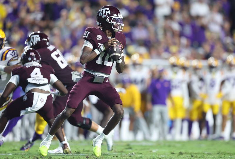 Oct 25, 2025; Baton Rouge, Louisiana, USA; Texas A&M Aggies quarterback Marcel Reed (10) drops to throw during the first half against the Louisiana State Tigers at Tiger Stadium. Mandatory Credit: Stephen Lew-Imagn Images