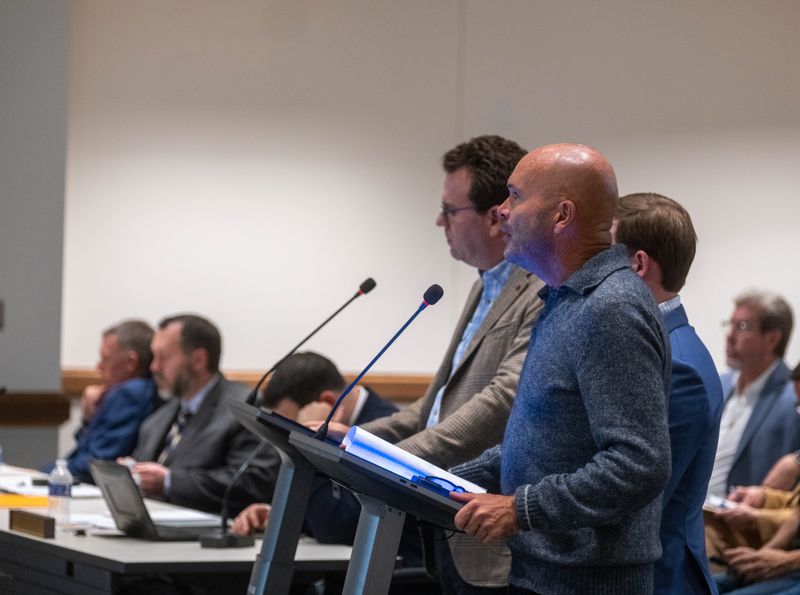 Fermi America co-founder Toby Neugebauer, right, speaks alongside his son Nate Neugebauer and Chief Development Officer Charlie Hamilton during Tuesday’s Amarillo City Council meeting.