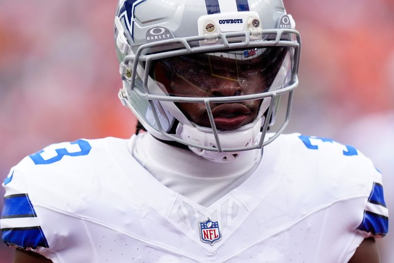 Oct 26, 2025; Denver, Colorado, USA; Dallas Cowboys running back Javonte Williams (33) looks on before the game against the Denver Broncos at Empower Field at Mile High. Mandatory Credit: Ron Chenoy-Imagn Images