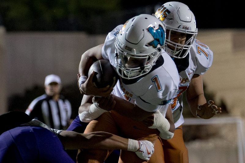 Pebble Hills’ Joe Fernandez (1) is tackled during a District 1-6A high school football game against Eastlake on Friday, Oct. 31, 2025, at SAC 1 in El Paso, Texas.