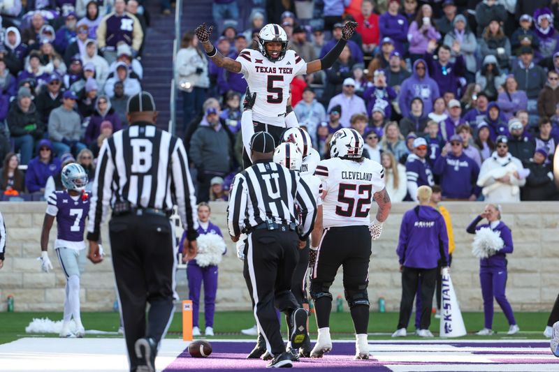 Nov 1, 2025; Manhattan, Kansas, USA; Texas Tech Red Raiders wide receiver Caleb Douglas (5) celebrates with his teammates after scoring a touchdown in the third quarter against the Kansas State Wildcats at Bill Snyder Family Football Stadium. Mandatory Credit: Scott Sewell-Imagn Images