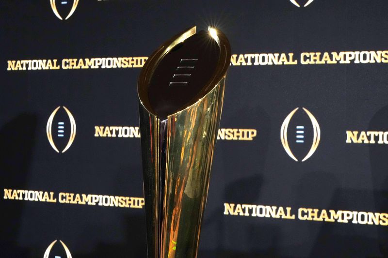 Jan 21, 2025; Atlanta, GA, USA; The College Football Playoff National Championship trophy at press conference at The Westin Peachtree Plaza, Savannah Ballroom. Mandatory Credit: Kirby Lee-Imagn Images