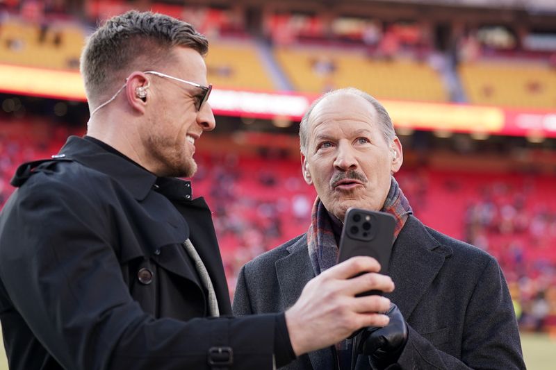 Jan 26, 2025; Kansas City, MO, USA; Former NFL player J.J. Watt and former coach Bill Cowher react on the field before the AFC Championship game between the Buffalo Bills and Kansas City Chiefs at GEHA Field at Arrowhead Stadium. Mandatory Credit: Denny Medley-Imagn Images
