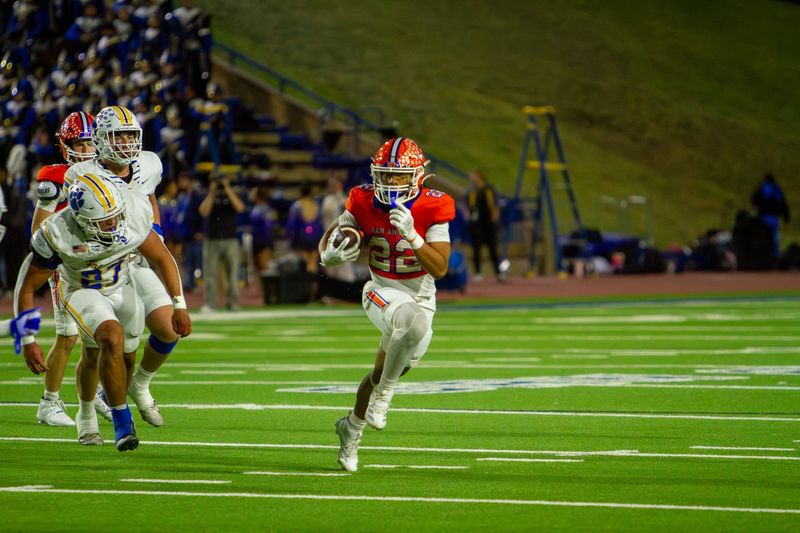 San Angelo Central football's Darius Huitt (22) runs with the ball against Wolfforth Frenship at San Angelo Stadium on Thursday, Nov. 6, 2025.