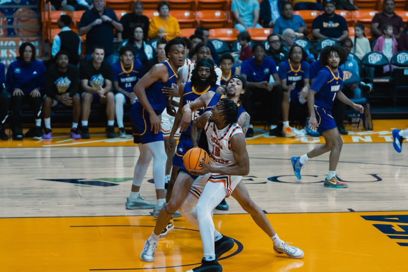 UTEP's Elijah Jones maneuvers in the lane Friday night against Western New Mexico at the Don Haskins Center