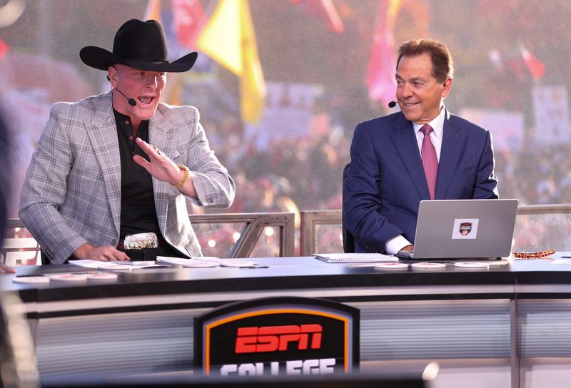 ESPN personality Pat McAfee talks during College GameDay as Nick Saban looks on, Saturday, Nov. 8, 2025, at Jones AT&T Stadium.