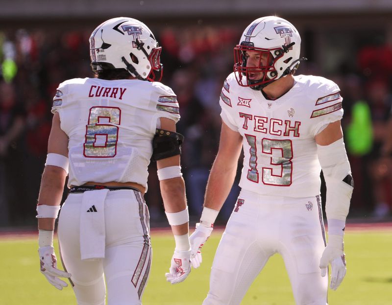 Texas Tech linebackers Ben Roberts (13) and John Curry celebrate a tackle against BYU during a Big 12 Conference football game, Saturday, Nov. 8, 2025, at Jones AT&T Stadium.